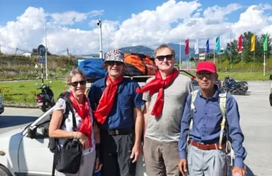 Annapurna Circuit Trek Guide Family Friendly Routes Family and guide preparing for a hike together near vehicles featured in the Annapurna Circuit Trek Guide.
